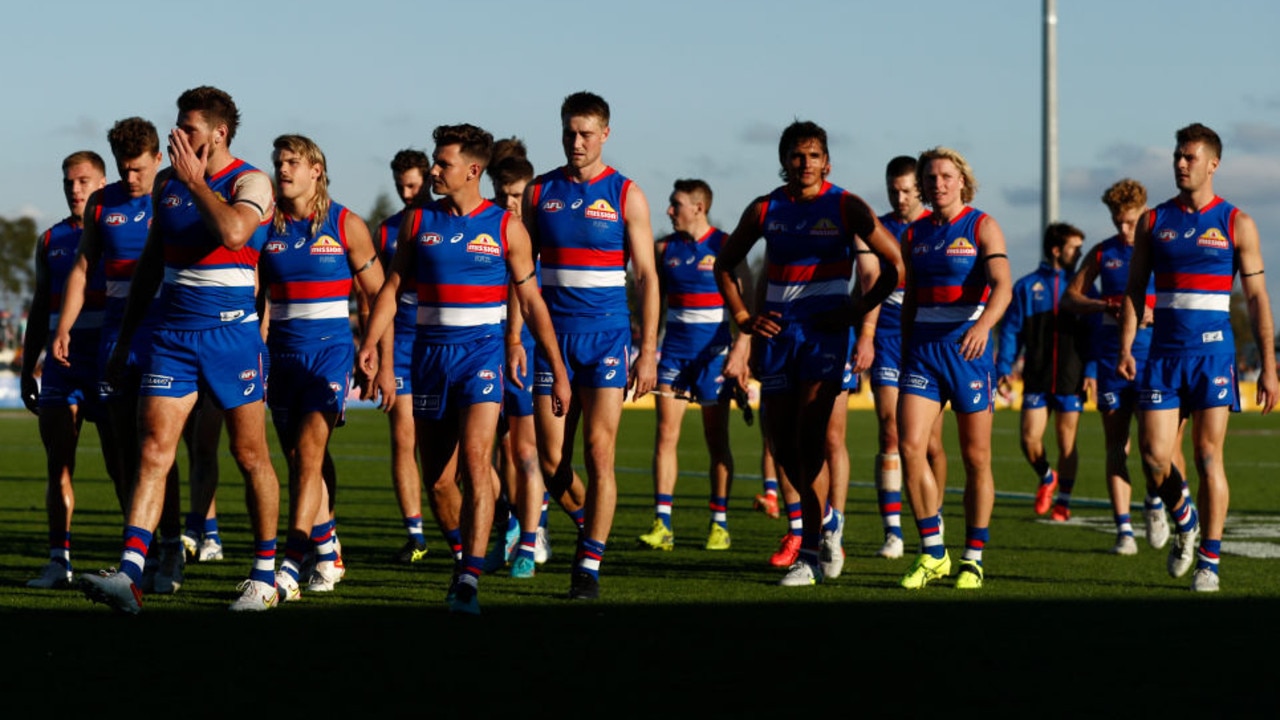 BALLARAT, AUSTRALIA - APRIL 23: Dejected Western Bulldogs players walk from the ground after the round six AFL match between the Western Bulldogs and the Adelaide Crows at Mars Stadium on April 23, 2022 in Ballarat, Australia. (Photo by Darrian Traynor/Getty Images)