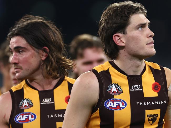 MELBOURNE, AUSTRALIA - APRIL 28: Will Day and his Hawks team mates look dejected after losing the round seven AFL match between Hawthorn Hawks and Sydney Swans at Melbourne Cricket Ground, on April 28, 2024, in Melbourne, Australia. (Photo by Quinn Rooney/Getty Images)