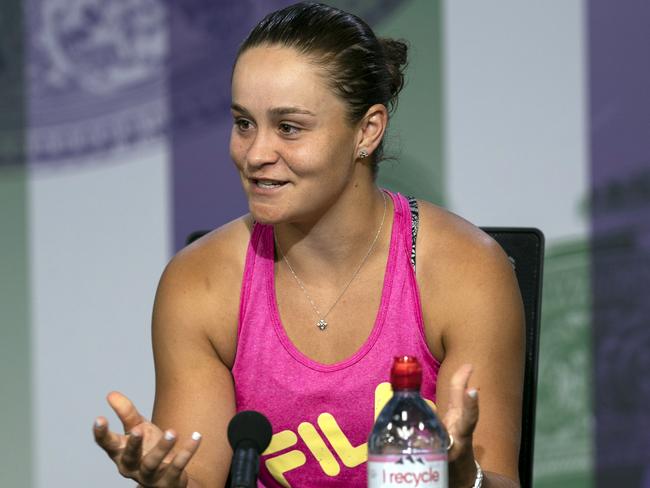 Australia's Ashleigh Barty smiles as she talks to the media during a press conference after losing her Women's singles match against United States' Alison Riske during day seven of the Wimbledon Tennis Championships in London, Monday, July 8, 2019. (Adam Warner, AELTC via AP)