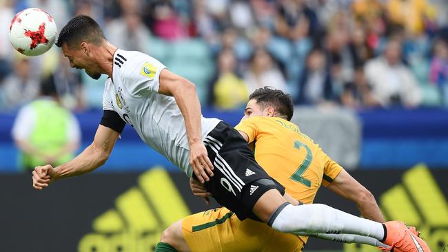 Germany's forward Sandro Wagner heads the ball past Australia's defender Milos Degenek.