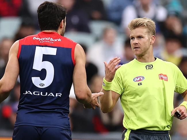 MELBOURNE . 15/04/2023.  AFL . Round 5. Gather Round.  Essendon vs Melbourne at the Adelaide Oval.  Umpire Nathan Williamson pays a 50 mtr penalty against Christian Petracca of the Demons    . Pic: Michael Klein