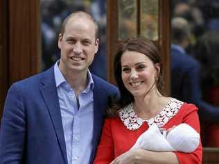 NOT IMPRESSED: Britain's Prince William and Kate, Duchess of Cambridge pose for a photo with their baby son. Picture: Kirsty Wigglesworth