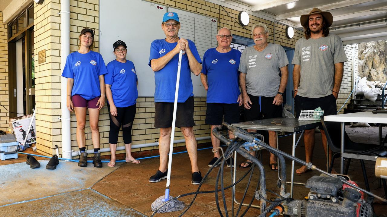 Ellis Beach Surf Lifesaving Club members Erin Buckley, Skye Boothe, Mick Roberts, Dave Donnelly, Graeme Boothe and Hugo Doessel have helped clean up after flooding rain tore through the clubhouse. Picture: Brendan Radke