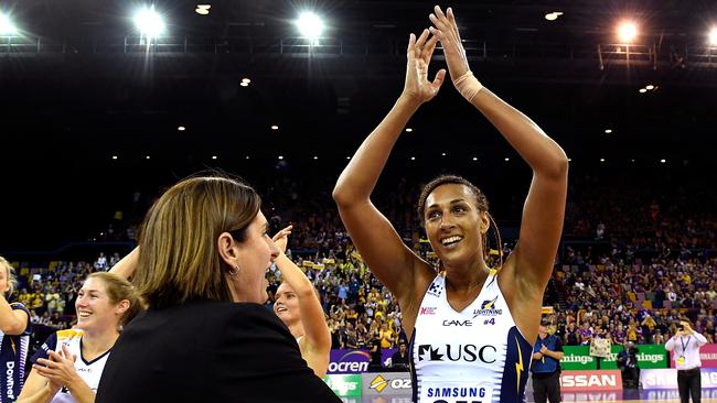 Sunshine Coast star defender Geva Mentor celebrates with assistant coach Kylee Byrne after the Lightning’s semi-final win over the Firebirds. Picture: Getty Images