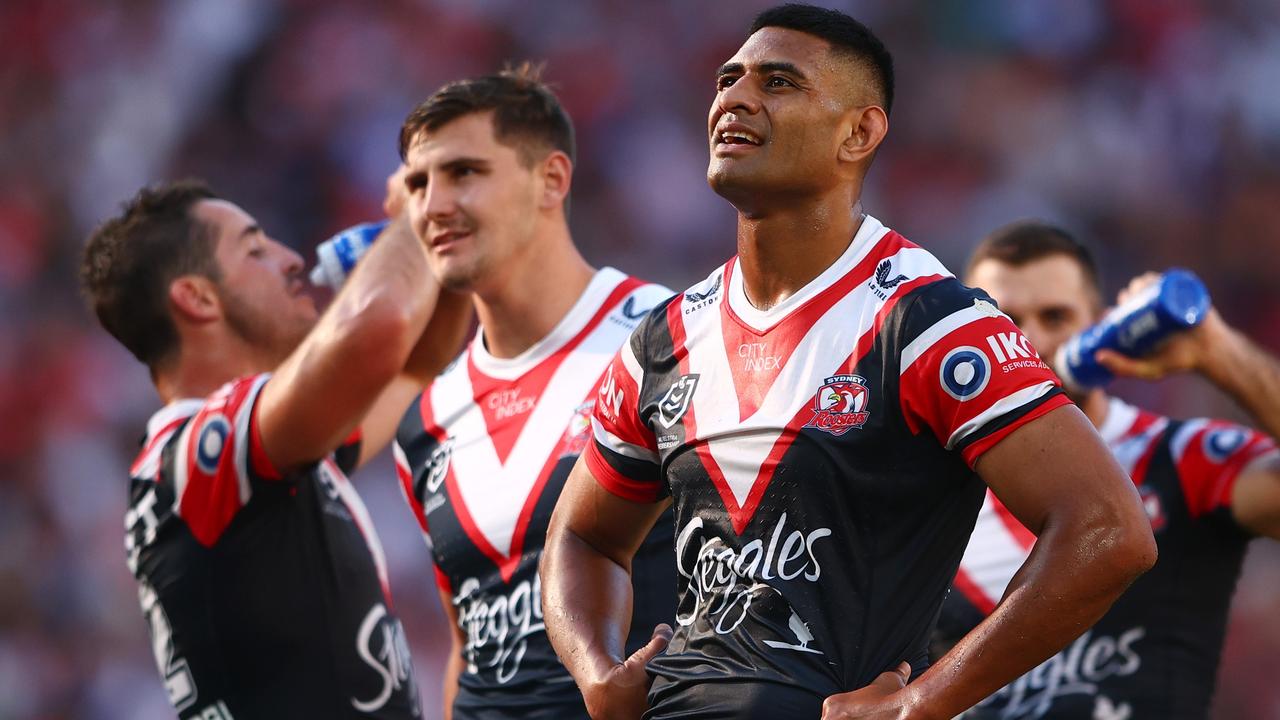 Daniel Tupou and the Roosters dejected during the loss to the Dolphins.