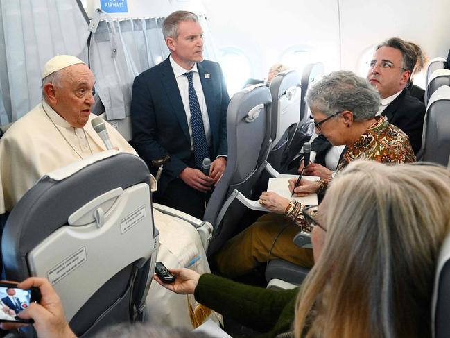 Pope Francis speaks to journalists during the flight from Budapest to Italy Picture: AFP