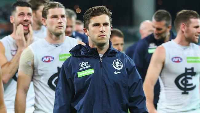 Marc Murphy leads the Blues off Adelaide Oval on Friday night.