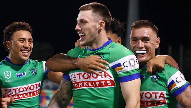 CANBERRA, AUSTRALIA - APRIL 07: James Schiller of the Raiders celebrates scoring a try with team mates during the round five NRL match between Canberra Raiders and Parramatta Eels at GIO Stadium, on April 07, 2024, in Canberra, Australia. (Photo by Mark Nolan/Getty Images)