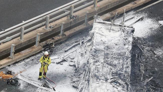 Firefighters and emergency services at the scene of a Truck Crash on the M1 bridge over the Nerang River at Nerang. Picture Glenn Hampson