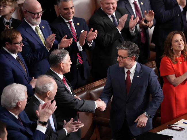 Mike Johnson is congratulated by his colleagues. Picture: Andrew Harnik / Getty