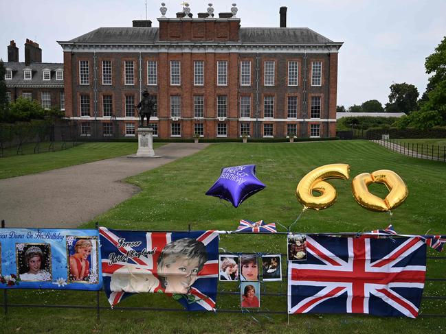 Tributes attached to the gates of Kensington Palace. Picture: AFP