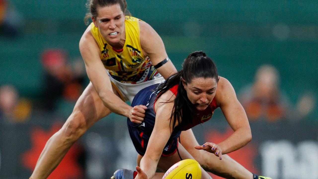 Skipper Chelsea Randall tackles Sinead Goldrick in a surprise appearance from injury. Picture: Dylan Burns/AFL Photos via Getty Images