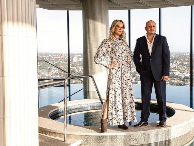 Larry Kestelman with his partner Anita Pahor atop teh Captial Grand building. Picture: Nic Walker