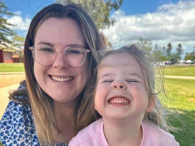 Maddy Morphett, who is about to start intensive oral cancer treatment for an extremely rare form of locally aggressive and invasive sarcoma, with her daughter Evelyn. Picture: Supplied