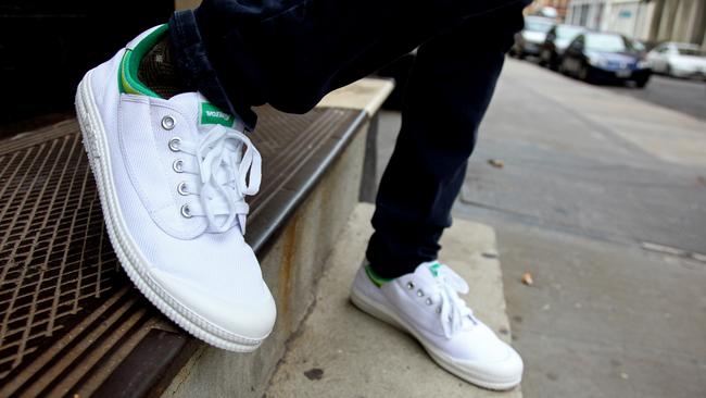 Ryan Black, a New York retailer, wears a pair of Dunlop Volleys Monday, August 16, 2010 in front of the Steven Alan Annex clothing store in the Tribeca neighborhood of New York City. Black enjoys the comfort of what many Australians may see as an everyday work shoe for comfort and good grip while on the job. Photo by CRaig Ruttle