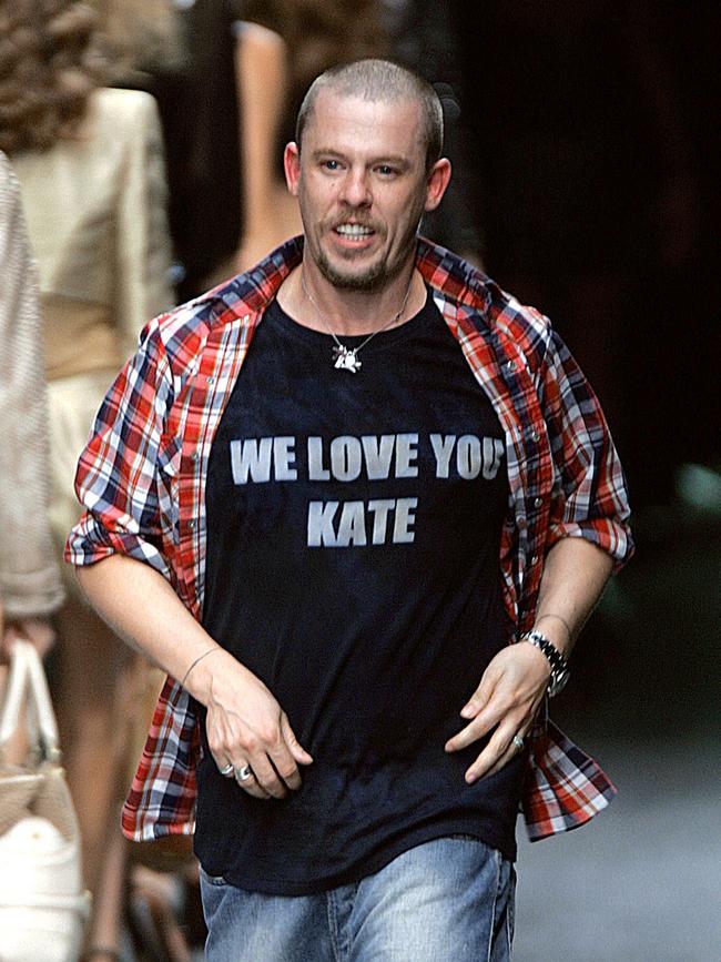 McQueen salutes at the end of his show during the Spring/Summer 2006 Ready-to-Wear collections in Paris in October 2005.