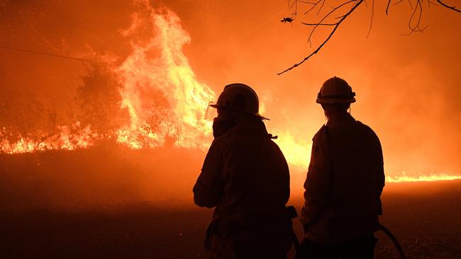 NSW Rural Fire Service crews protect properties north of Sydney. Picture: AAP