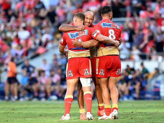 BRISBANE, AUSTRALIA - MARCH 05: Felise Kaufusi of the Dolphins celebrates victory with team mates Jesse Bromwich and Brenko Lee of the Dolphins as the Dolphins claim their first ever victory in the NRL after the round one NRL match between the Dolphins and Sydney Roosters at Suncorp Stadium on March 05, 2023 in Brisbane, Australia. (Photo by Bradley Kanaris/Getty Images)