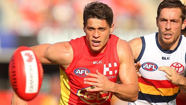 GOLD COAST, AUSTRALIA - MAY 21: Dion Prestia of the Suns and Richard Douglas of the Crows compete for the ball during the round nine AFL match between the Gold Coast Suns and the Adelaide Crows at Metricon Stadium on May 21, 2016 in Gold Coast, Australia. (Photo by Chris Hyde/Getty Images)