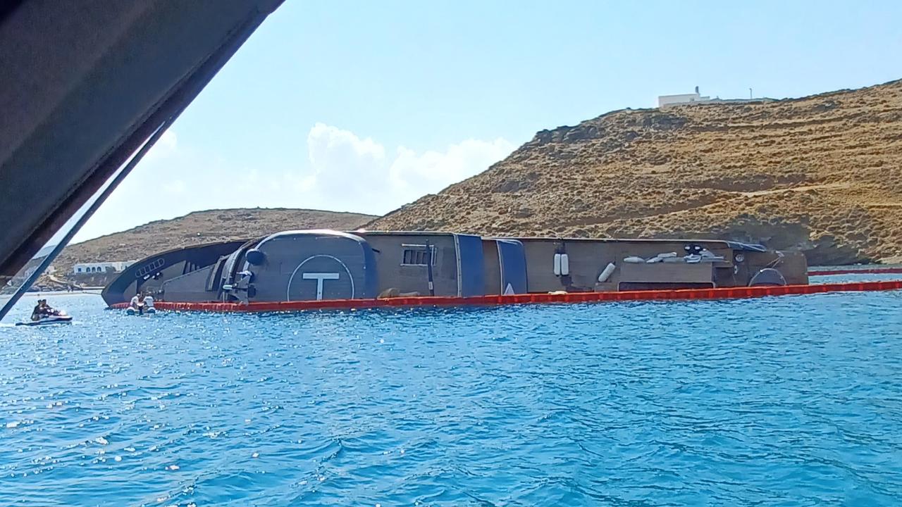 The 007 yacht lying on its side after running aground. Picture: SWNS/Mega