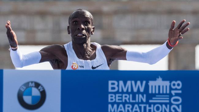 Kenya's Eliud Kipchoge crosses the finish line to win the Berlin Marathon setting a new world record on September 16 in Berlin. Picture: AFP