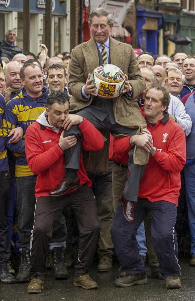 Shrovetide annual football match where a nervous Prince of Wales is lifted up by the crowd Picture: Arthur Edwards.