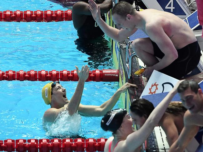 Australia's Cate Campbell (L) celebrates taking gold in the final of the mixed 4x100m medley relay. Picture: Ed Jones/AFP