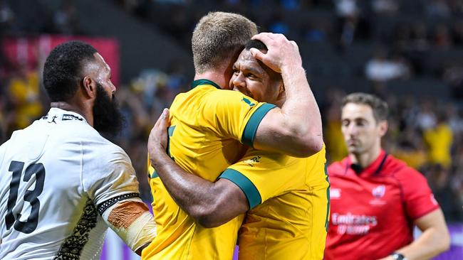 Australian stars show their relief after a tough win.