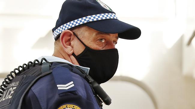 DAILY TELEGRAPH - Commuters at Central station pictured after a mandatory mask etiquette was brought into place due to COVID-19. Police officers remind public they need to wear a mask. Picture: Sam Ruttyn