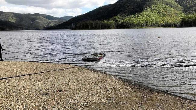 Clayton's Towing machinery dragged the car from Borumba Dam on Thursday afternoon before human remains were discovered inside. Picture: Contributed