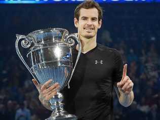 Britain's Andy Murray holds up the ATP world No.1 trophy following his win over Novak Djokovic in the men's singles final at the ATP World Tour Finals at the O2 Arena in London. Picture: ANDY RAIN