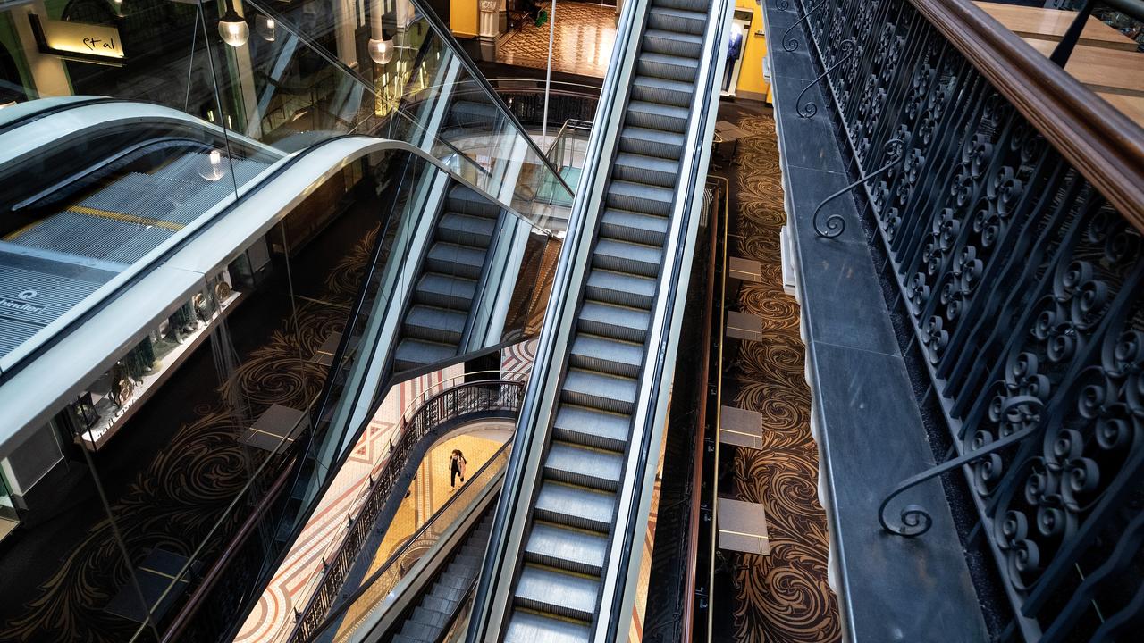 A woman walks through the Queen Victoria Building on April 01, 2020 in Sydney, Australia, and finds it empty. Picture: Cameron Spencer/Getty Images