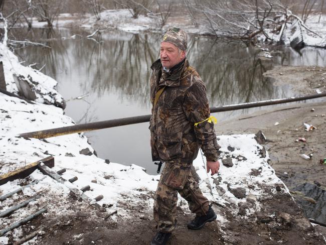 A Ukrainian serviceman walks by the Irpin river in Irpin, Ukraine, as Russian forces continue to advance on the Ukrainian capital of Kyiv. Picture: Getty Images