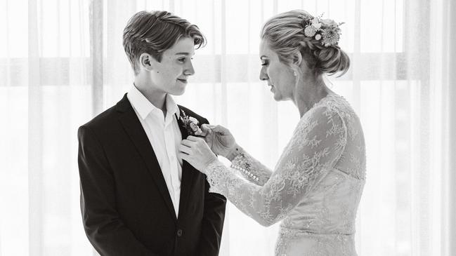 William Pfeiffer, who died suddenly in his sleep at 14, with his mum, Karen Lynch on her wedding day. Picture: Simon Bills