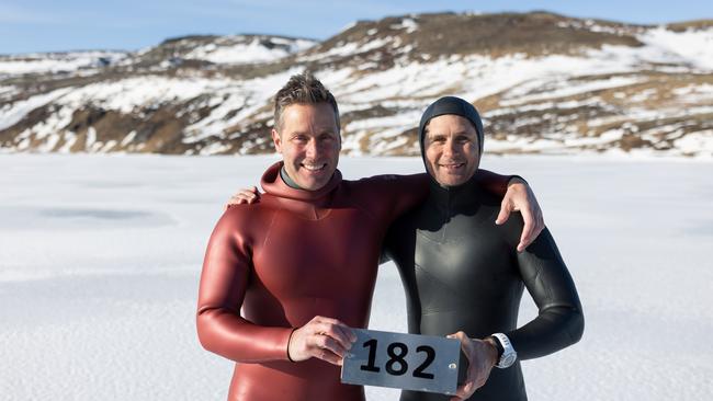 Free diver Ant Williams with his safety diver Johnny Sunnex after breaking the world record for swimming 182m under ice - the longest distance using a single breath.