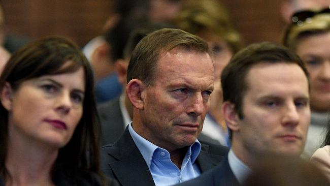 Former prime minister Tony Abbott watches Prime Minister Malcolm Turnbull deliver his address at the 59th Liberal Party Federal Council Meeting in Sydney on Saturday Picture: Dan Himbrechts / AAP