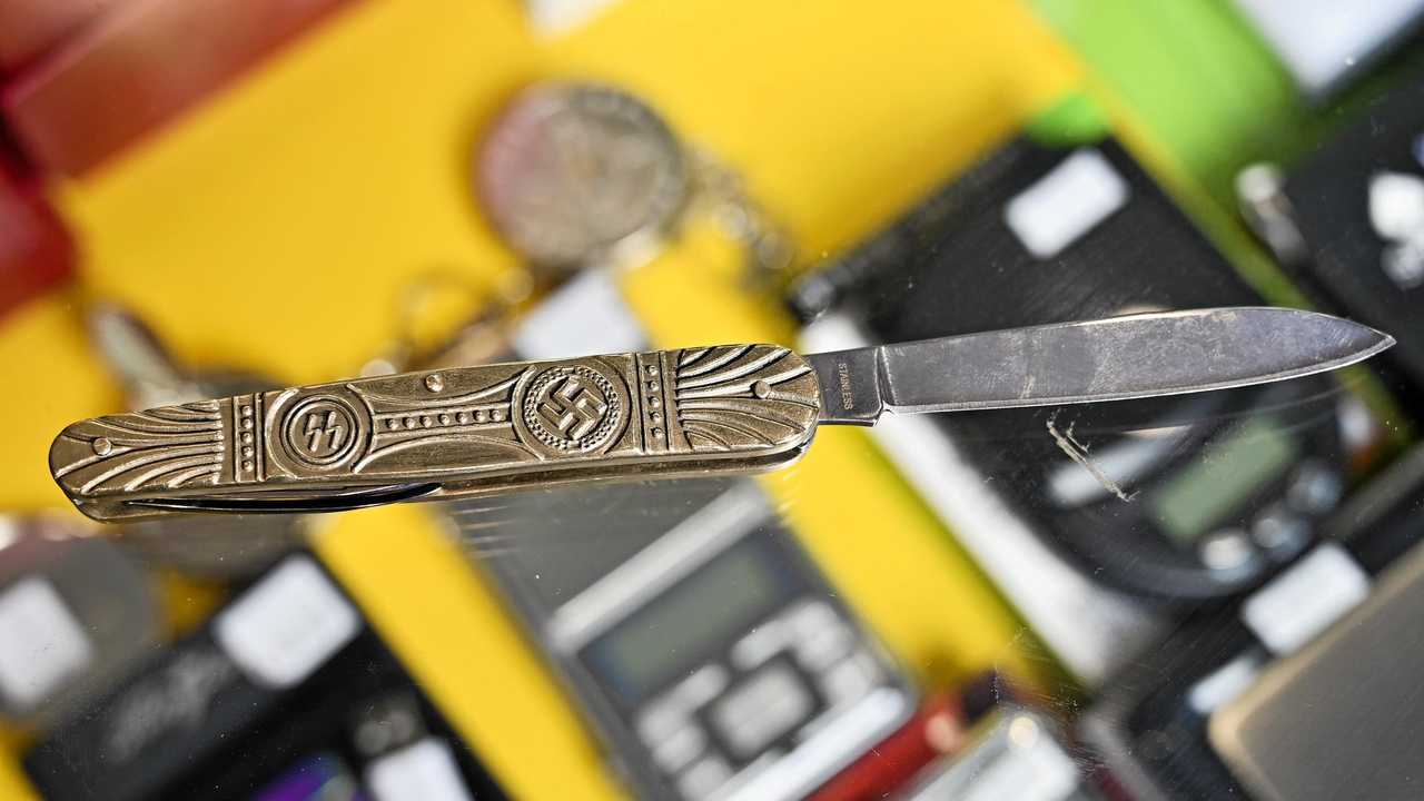 owner of TSG Tobacco at Booval Fair Hitesh Khatri  was mistakenly selling a knife with Nazi symbols. Picture: Cordell Richardson