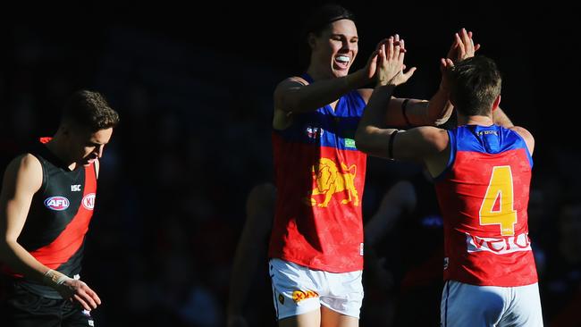 MELBOURNE, AUSTRALIA — JULY 02: Eric Hipwood of the Lions and Ryan Bastinac (R) celebrates a goal in the dying stages during the round 15 AFL match between the Essendon Bombers and the Brisbane Lions at Etihad Stadium on July 2, 2017 in Melbourne, Australia. (Photo by Michael Dodge/Getty Images)