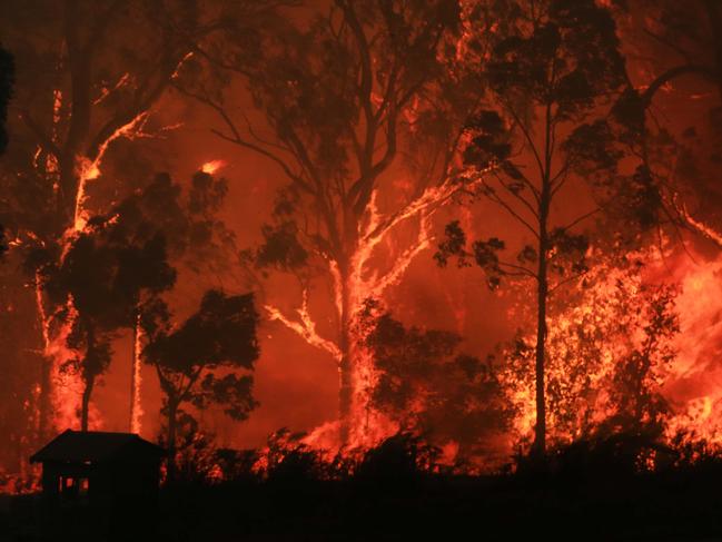 Fire and emergency services just south of the small Gippsland town of Bruthen, 30 December, 2019. Picture: Aaron Francis