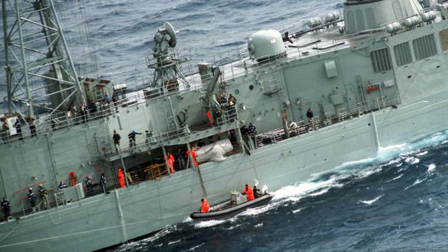 The rescue craft carrying solo round-the-world yachtsman Tony Bullimore, approaches the frigate HMAS Adelaide.