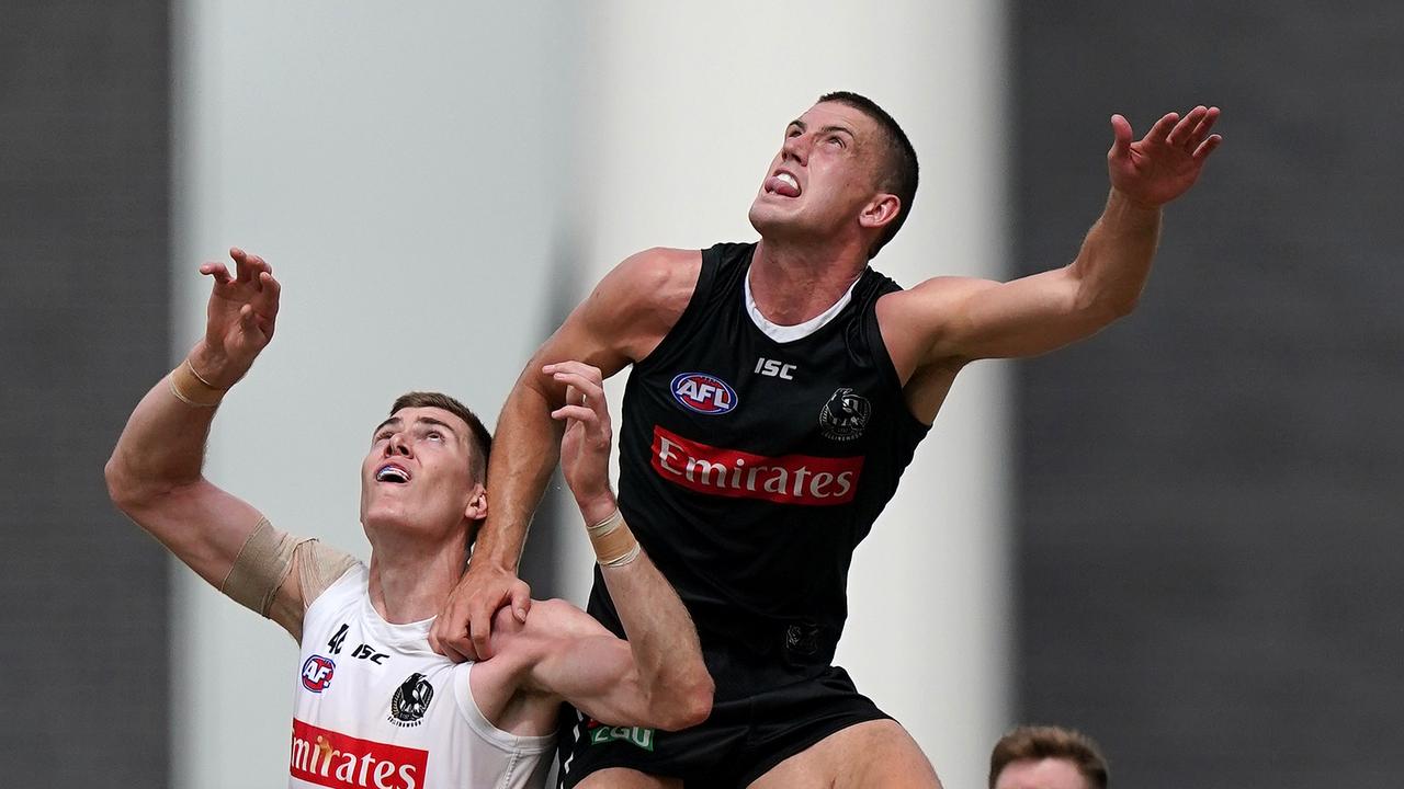 Darcy Cameron flies over Mason Cox during match simulation at the Holden Centre