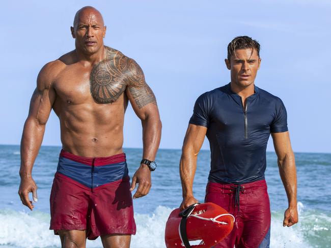 This image released by Paramount Pictures shows Dwayne Johnson as Mitch Buchannon, left, and Zac Efron as Matt Brody in "Baywatch." (Frank Masi/Paramount Pictures via AP)