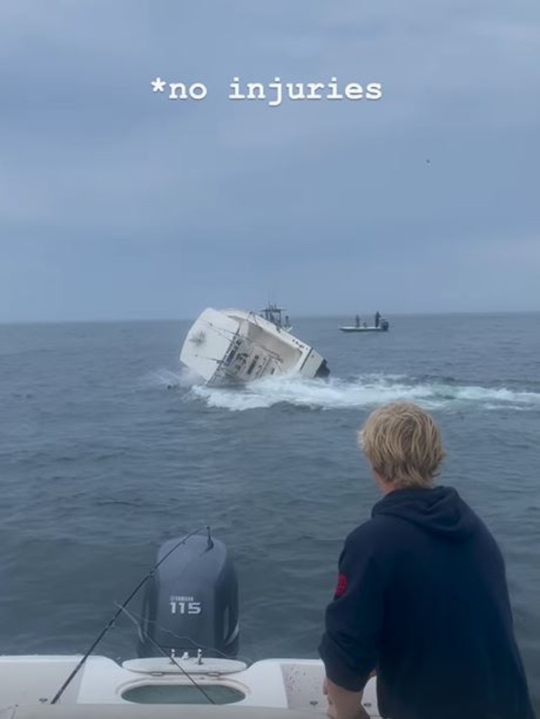 The boat went on its side before flipping over.