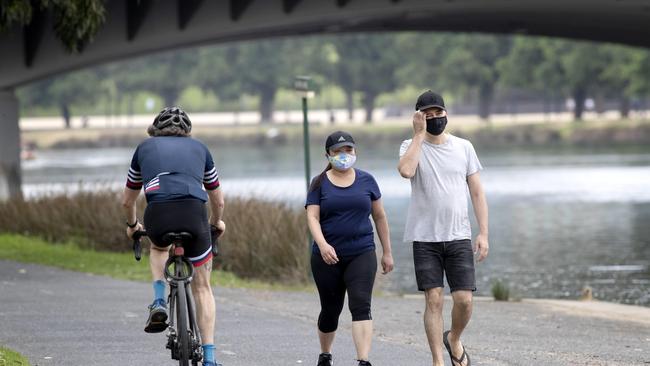 People wearing masks along the Yarra trail on Sunday as restrictions on mandatory mask wearing are about to be eased in Melbourne. Picture: NCA NewsWire / David Geraghty