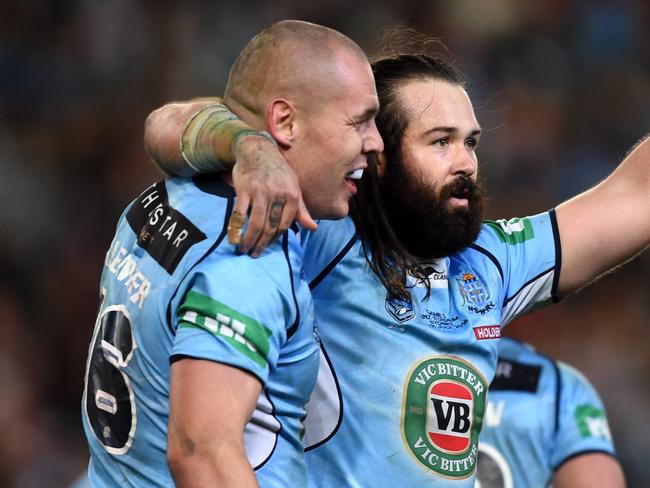 Aaron Woods (right) and David Klemmer of the Blues celebrate their win in State of Origin Game III between the NSW Blues and Queensland Maroons, at ANZ Stadium in Sydney on Wednesday, July 13, 2016. (AAP Image/Paul Miller) NO ARCHIVING, EDITORIAL USE ONLY