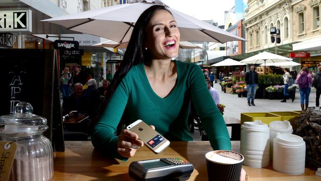 Phones as credit cards ... Marketing consultant Marianthi Livaditis uses her phone to pay for coffees, groceries and other items. Pic: Tricia Watkinson