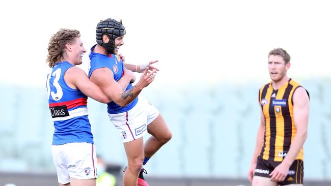 Aaron Naughton holds Caleb Daniel aloft after a goal. Picture: Sarah Reed