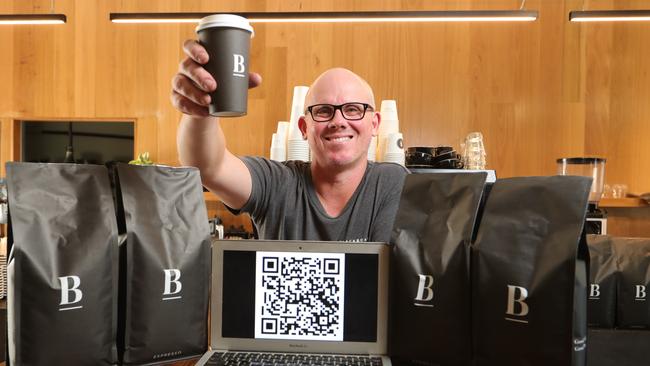 Blackboard Varsity general manager Wayne Keating with a QR Code system to electronically store your details when you wish to dine in for breakfast and coffee. Picture Glenn Hampson