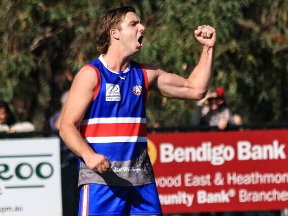 Max King celebrates one of his three goals in the first term. Picture: Davis Harrigan