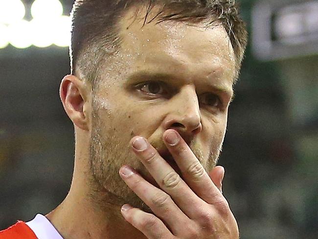 MELBOURNE, AUSTRALIA - AUGUST 10:  Nathan Brown of the Saints leaves the field with his teammates after losing the round 21 AFL match between the Essendon Bombers and the St Kilda Saints at Etihad Stadium on August 10, 2018 in Melbourne, Australia.  (Photo by Scott Barbour/Getty Images)